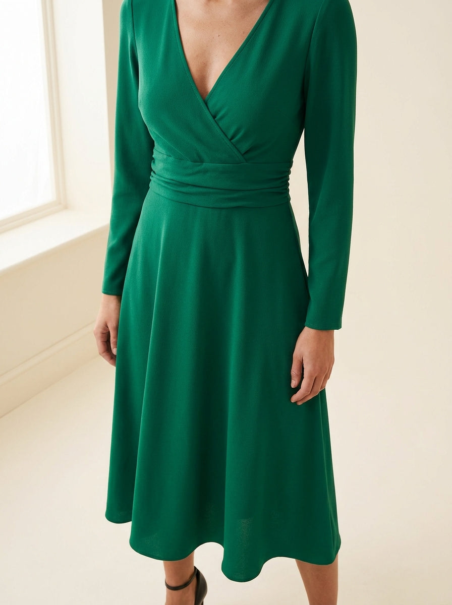 emerald green long sleeve midi dress with softly ruched waist — detail view