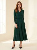emerald green long sleeve midi dress with softly ruched waist — front view
